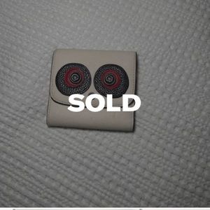 Coach leather wallet. Can expand to fit cash and many cards.